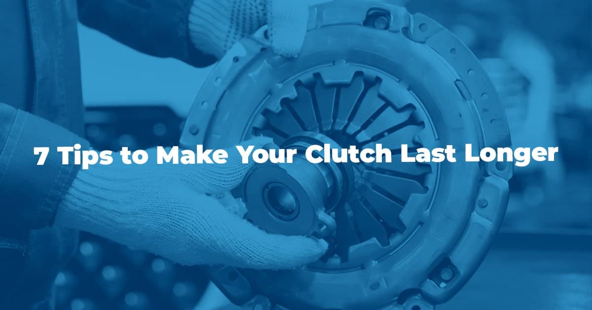 The article title over a mechanic holding a clutch during maintenance.