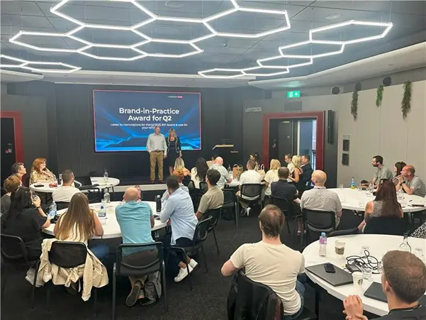 Toby Hughes presenting Workshop of the Year award 2025 at Automotive Magazine (AM) awards alongside comedian Tom Allen.